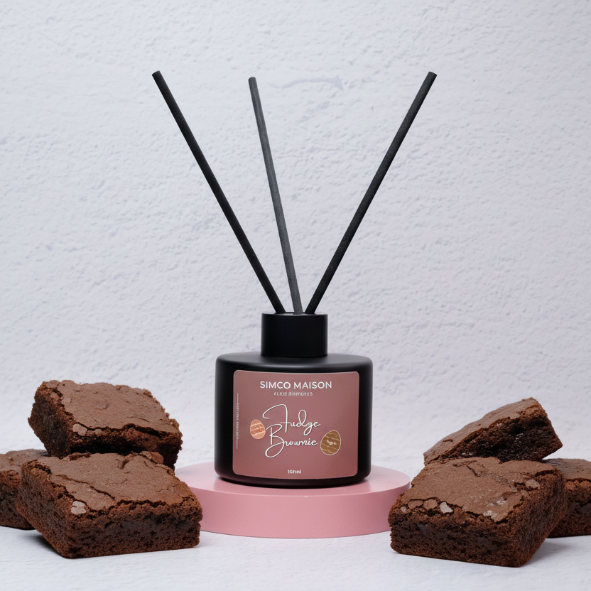 Diffuser with decorative sticks and brownies on a light background