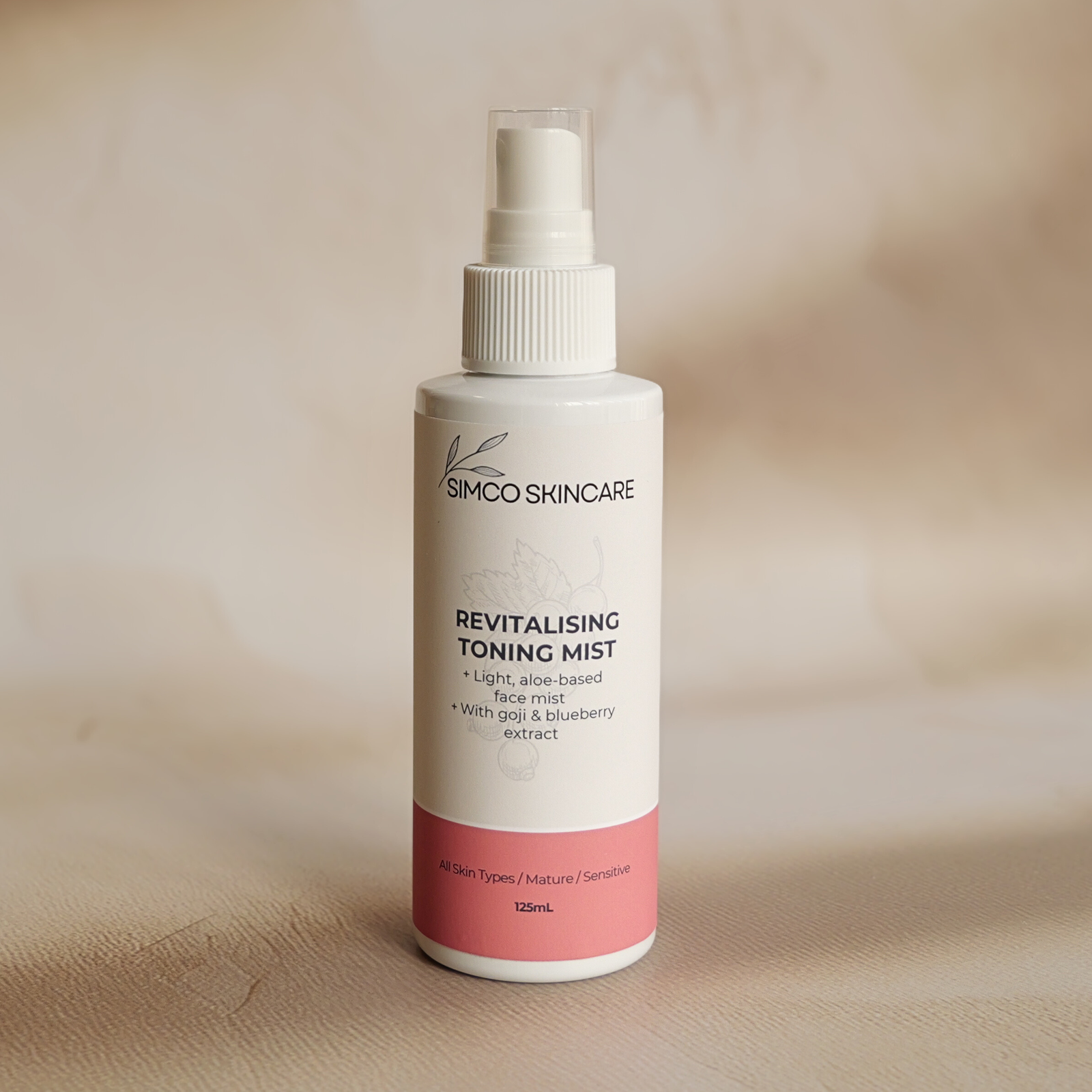 Simco Skincare revitalizing toning mist bottle on a beige background