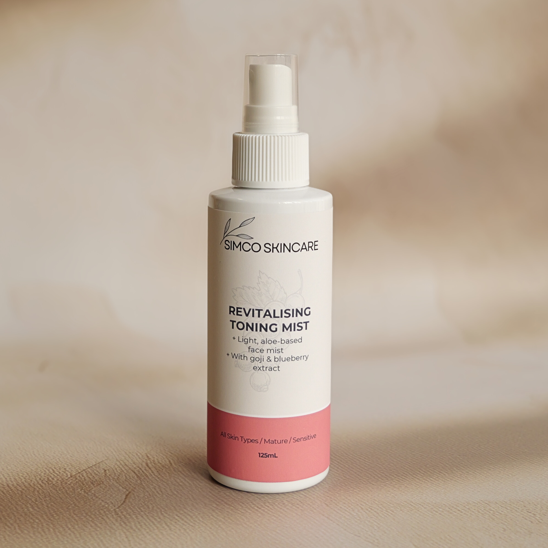 Simco Skincare revitalizing toning mist bottle on a beige background